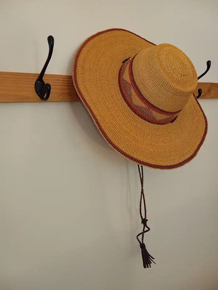Photo of an old fashioned hat on a hat rack